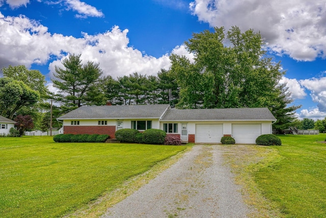 3180 Sitterley Rd NW, Canal Winchester, OH 43110 - ranch-style home featuring driveway, an attached garage, a front lawn, and brick siding