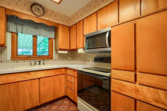 3180 Sitterley Rd NW, Canal Winchester, OH 43110 - kitchen featuring stainless steel microwave, white range with electric cooktop, light countertops, and decorative backsplash