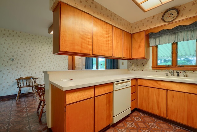 3180 Sitterley Rd NW, Canal Winchester, OH 43110 - kitchen featuring dishwasher, wallpapered walls, light countertops, and brown cabinets