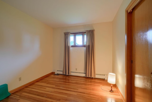 3180 Sitterley Rd NW, Canal Winchester, OH 43110 - unfurnished room with light wood-style flooring and baseboard heating