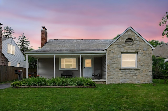 335 Letchworth Ave, Columbus, OH 43204 - view of front of house featuring stone siding, a chimney, and covered porch