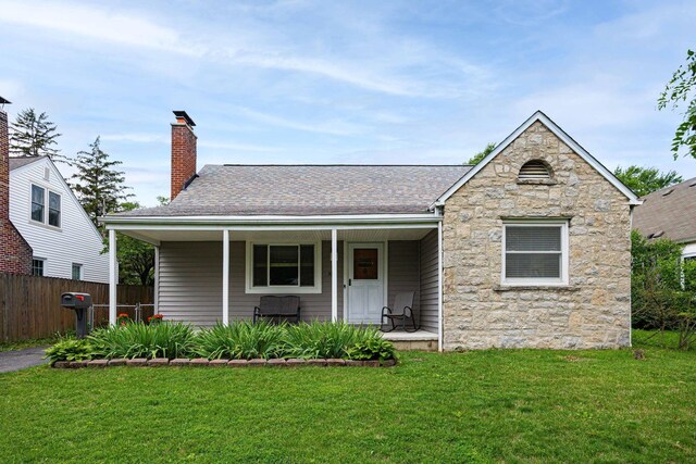335 Letchworth Ave, Columbus, OH 43204 - single story home with stone siding, a chimney, covered porch, and a shingled roof