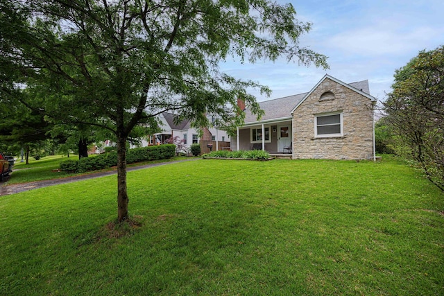 335 Letchworth Ave, Columbus, OH 43204 - ranch-style home featuring stone siding, a porch, and a front yard