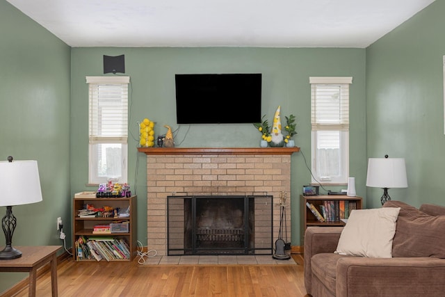335 Letchworth Ave, Columbus, OH 43204 - living room with a brick fireplace and wood finished floors