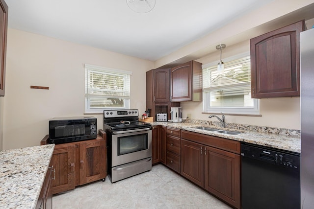 335 Letchworth Ave, Columbus, OH 43204 - kitchen featuring black appliances, light stone counters, and pendant lighting