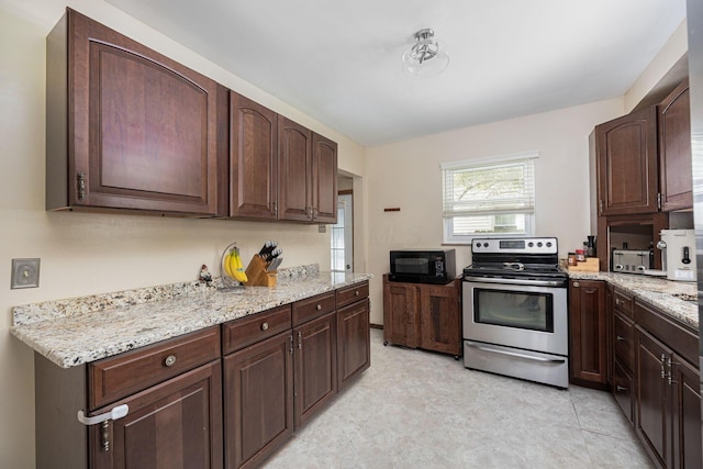 335 Letchworth Ave, Columbus, OH 43204 - kitchen featuring stainless steel electric range oven, black microwave, light stone counters, and dark brown cabinets