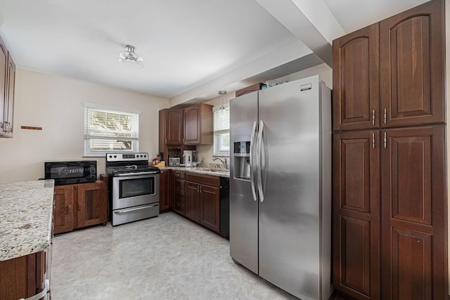 335 Letchworth Ave, Columbus, OH 43204 - kitchen with appliances with stainless steel finishes and healthy amount of natural light