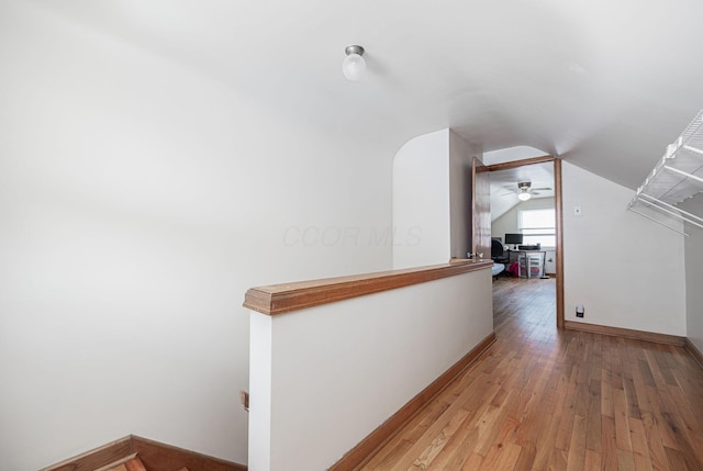 335 Letchworth Ave, Columbus, OH 43204 - hallway featuring vaulted ceiling, light wood-style floors, and an upstairs landing