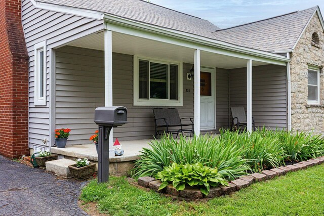 335 Letchworth Ave, Columbus, OH 43204 - entrance to property featuring covered porch and a shingled roof