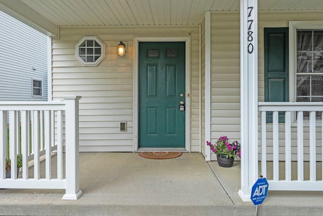 7780 Freesia St Unit 228, Blacklick, OH 43004 - view of exterior entry featuring covered porch