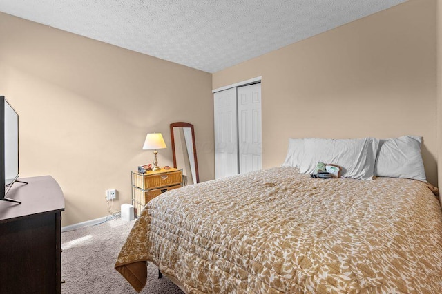 7780 Freesia St Unit 228, Blacklick, OH 43004 - bedroom featuring carpet floors, a closet, and a textured ceiling