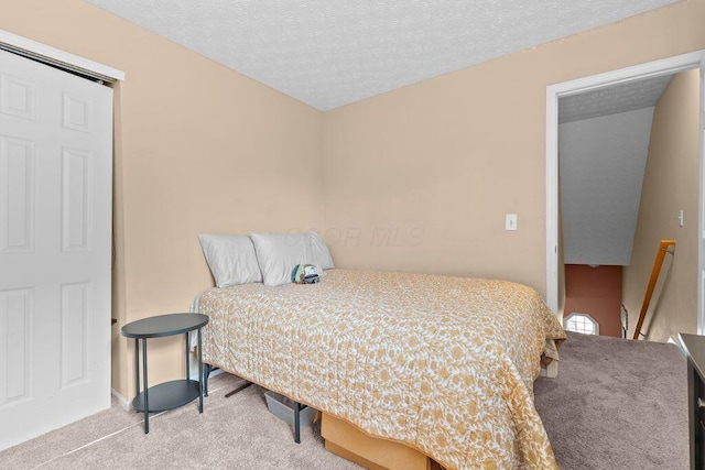7780 Freesia St Unit 228, Blacklick, OH 43004 - carpeted bedroom featuring a textured ceiling