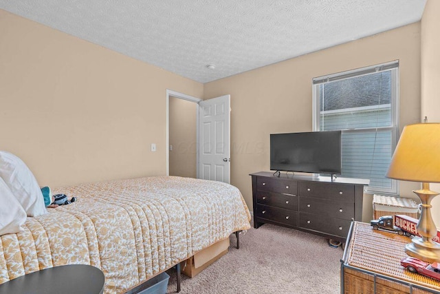 7780 Freesia St Unit 228, Blacklick, OH 43004 - bedroom with carpet floors and a textured ceiling