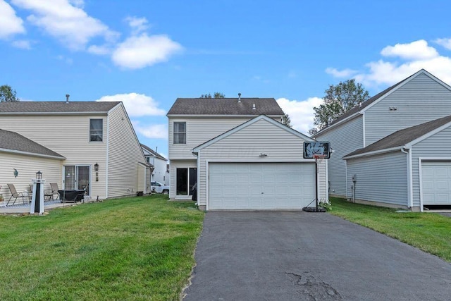 7780 Freesia St Unit 228, Blacklick, OH 43004 - view of front of house featuring driveway, a front yard, and a garage