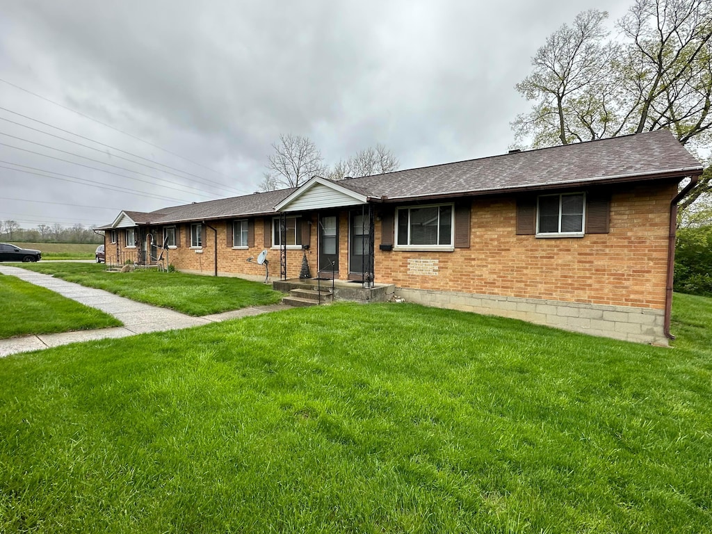 488 N Jay St, West Milton, OH 45383 - ranch-style house featuring brick siding, a front lawn, and a shingled roof