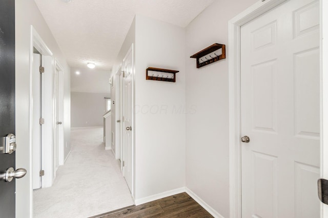 5595 Marshfield Dr, Westerville, OH 43081 - hallway with a textured ceiling and dark wood-type flooring