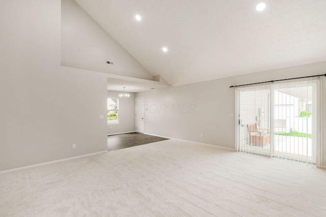 5595 Marshfield Dr, Westerville, OH 43081 - unfurnished living room with carpet floors, recessed lighting, a chandelier, and high vaulted ceiling