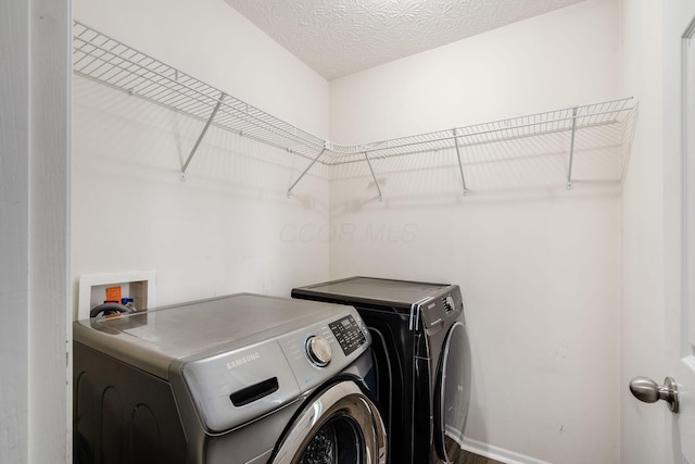 5595 Marshfield Dr, Westerville, OH 43081 - washroom featuring washer and clothes dryer and baseboards