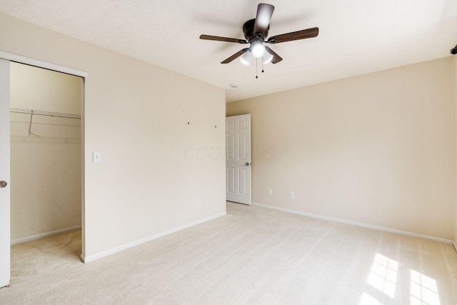 5595 Marshfield Dr, Westerville, OH 43081 - unfurnished bedroom featuring a closet, light colored carpet, a walk in closet, and a ceiling fan