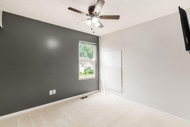 5595 Marshfield Dr, Westerville, OH 43081 - empty room featuring a ceiling fan, a textured ceiling, and light colored carpet