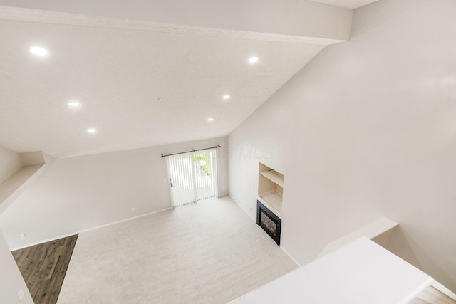 5595 Marshfield Dr, Westerville, OH 43081 - unfurnished living room featuring recessed lighting and a glass covered fireplace