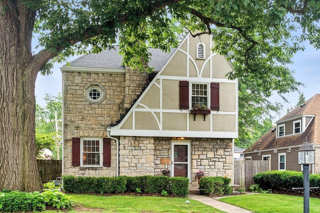 208 S Stanwood Rd, Bexley, OH 43209 - tudor-style house featuring stone siding, stucco siding, and roof with shingles