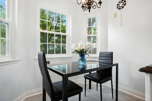 208 S Stanwood Rd, Bexley, OH 43209 - tiled dining space with a chandelier and plenty of natural light