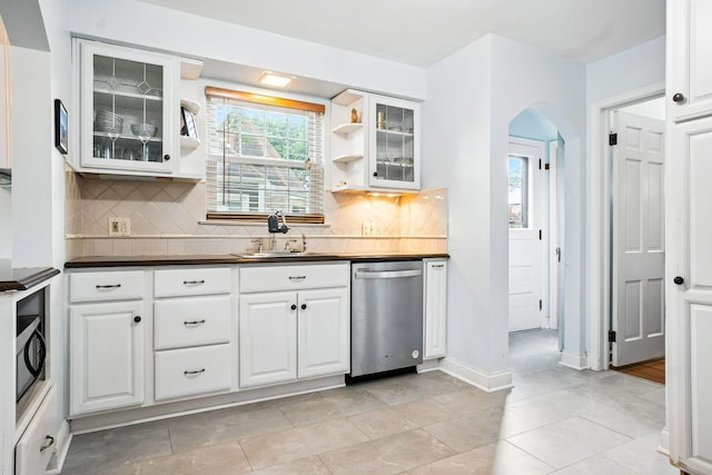 208 S Stanwood Rd, Bexley, OH 43209 - kitchen with appliances with stainless steel finishes, arched walkways, dark countertops, and white cabinetry
