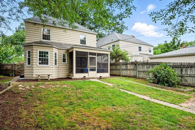 208 S Stanwood Rd, Bexley, OH 43209 - back of house featuring a sunroom, a fenced backyard, and a garden
