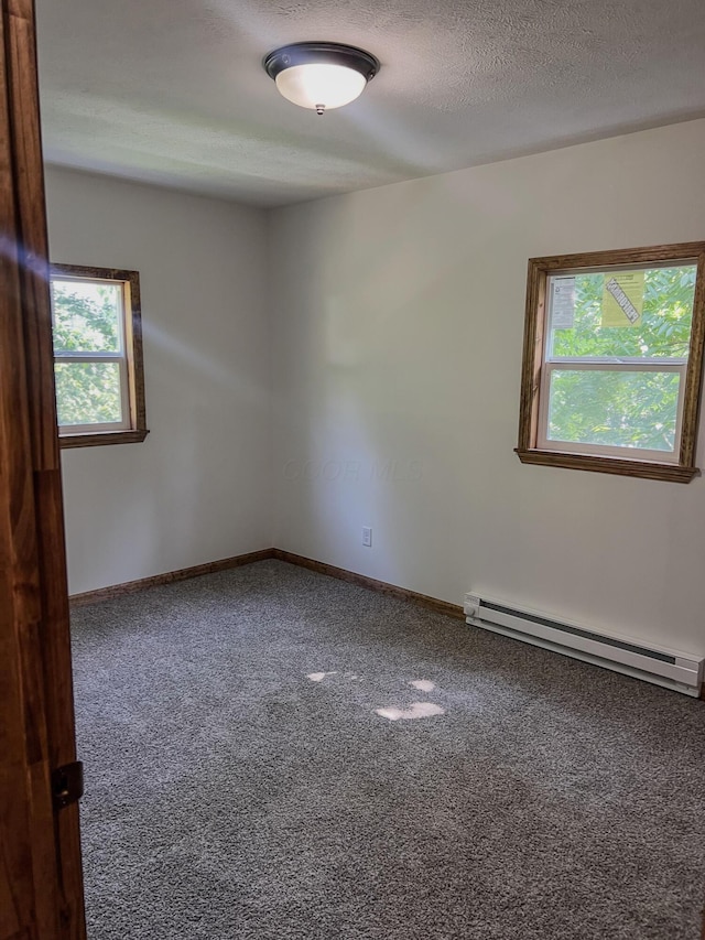 623 Glencroft Ave, Chillicothe, OH 45601 - carpeted empty room featuring a baseboard radiator and baseboards