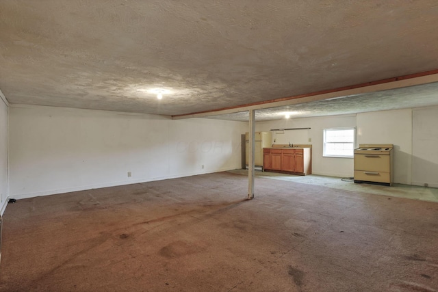 156 E Postal Ave, Newark, OH 43055 - basement featuring a textured ceiling, carpet floors, and freestanding refrigerator