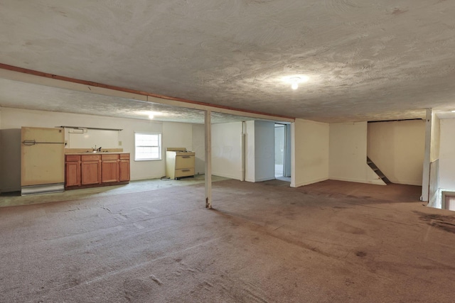156 E Postal Ave, Newark, OH 43055 - basement with freestanding refrigerator, light colored carpet, stairs, and a textured ceiling