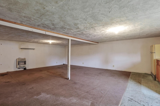156 E Postal Ave, Newark, OH 43055 - finished basement featuring heating unit, freestanding refrigerator, a textured ceiling, and carpet