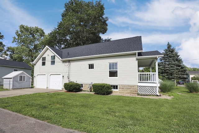 156 E Postal Ave, Newark, OH 43055 - view of front of property with a garage, a front yard, driveway, and a porch