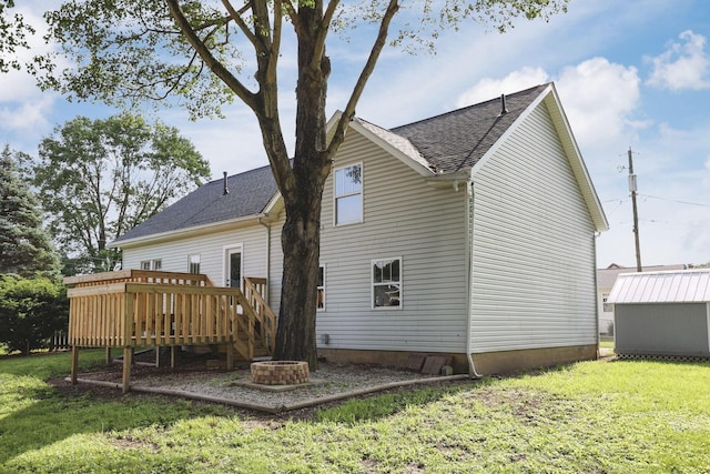156 E Postal Ave, Newark, OH 43055 - rear view of property featuring a lawn, roof with shingles, and a wooden deck