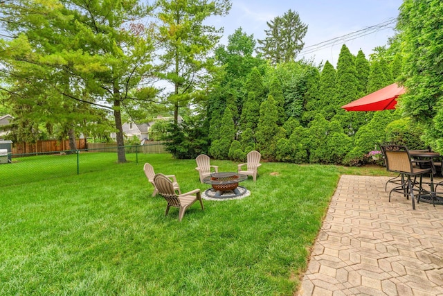 2222 Harwitch Rd, Columbus, OH 43221 - view of yard featuring an outdoor fire pit and a patio