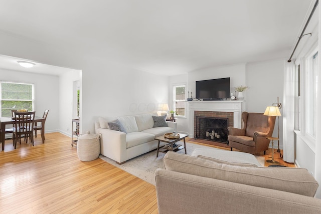 2222 Harwitch Rd, Columbus, OH 43221 - living area with light wood finished floors and a fireplace