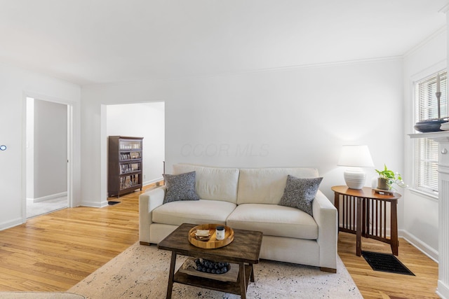 2222 Harwitch Rd, Columbus, OH 43221 - living room with light wood-style floors and crown molding
