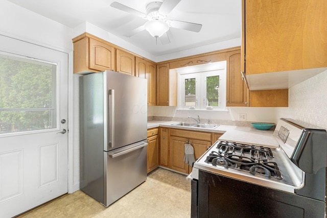 2222 Harwitch Rd, Columbus, OH 43221 - kitchen with stainless steel appliances, light countertops, plenty of natural light, and a ceiling fan