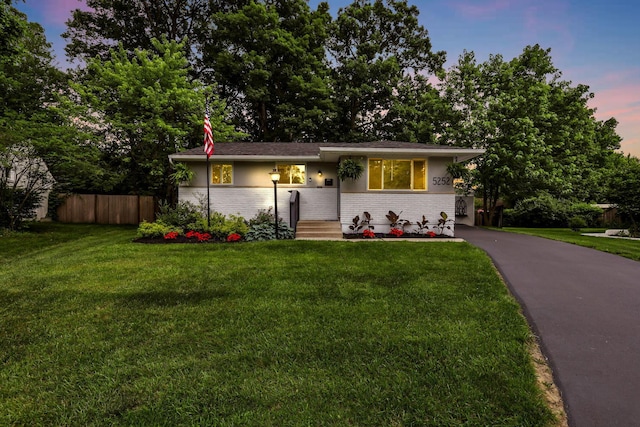5252 Roche Pl, Columbus, OH 43229 - view of front of property featuring brick siding and asphalt driveway