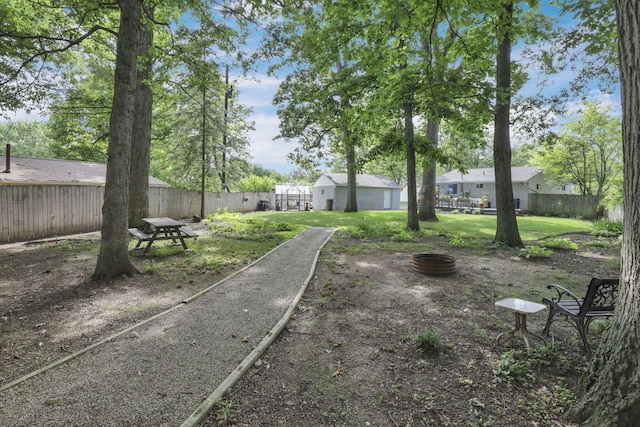 5252 Roche Pl, Columbus, OH 43229 - fenced backyard featuring a fire pit