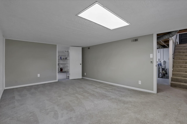 5252 Roche Pl, Columbus, OH 43229 - carpeted spare room featuring stairway and a textured ceiling