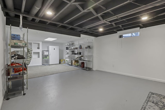 5252 Roche Pl, Columbus, OH 43229 - basement with freestanding refrigerator and baseboards