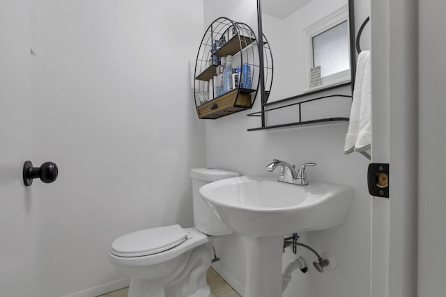 5252 Roche Pl, Columbus, OH 43229 - half bathroom with toilet and tile patterned floors