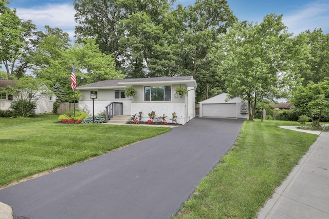 5252 Roche Pl, Columbus, OH 43229 - view of front of home featuring an outbuilding, a garage, a front yard, and brick siding