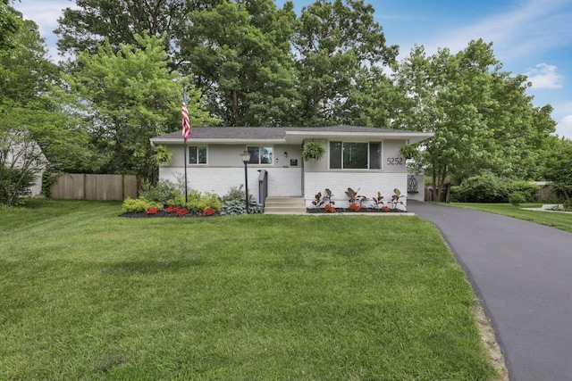 5252 Roche Pl, Columbus, OH 43229 - view of front of house featuring brick siding and asphalt driveway