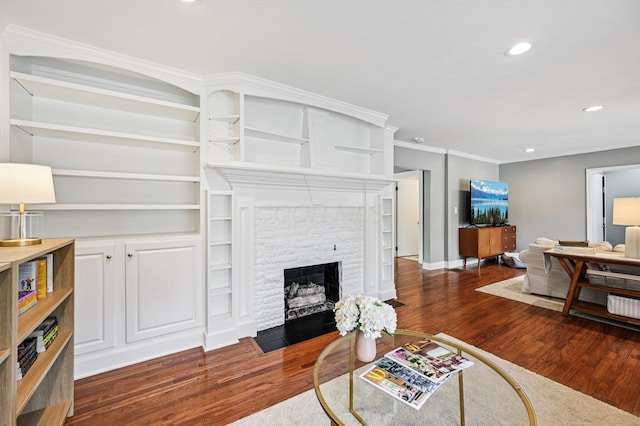 2361 Middlesex Rd, Upper Arlington, OH 43220 - living area featuring wood finished floors, a stone fireplace, recessed lighting, and crown molding
