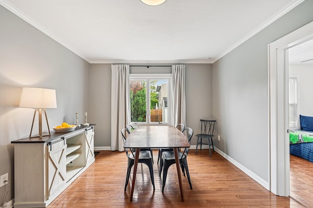 2361 Middlesex Rd, Upper Arlington, OH 43220 - dining area featuring light wood-type flooring and ornamental molding