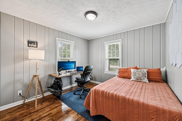2361 Middlesex Rd, Upper Arlington, OH 43220 - bedroom with wood-type flooring, multiple windows, a textured ceiling, and an office area