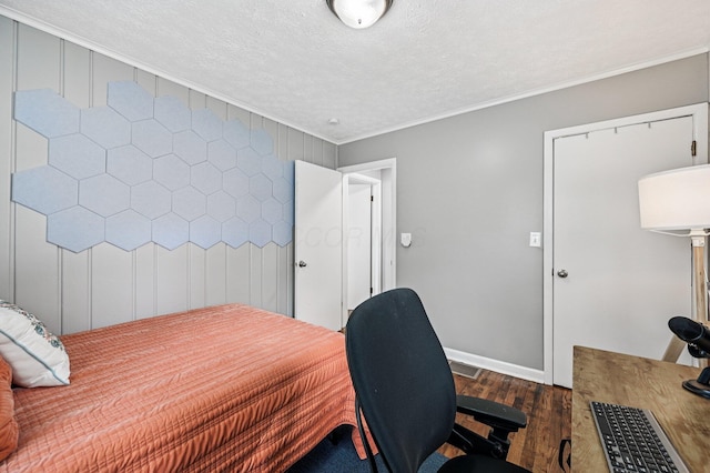2361 Middlesex Rd, Upper Arlington, OH 43220 - bedroom featuring dark wood-type flooring, crown molding, a textured ceiling, and an office area